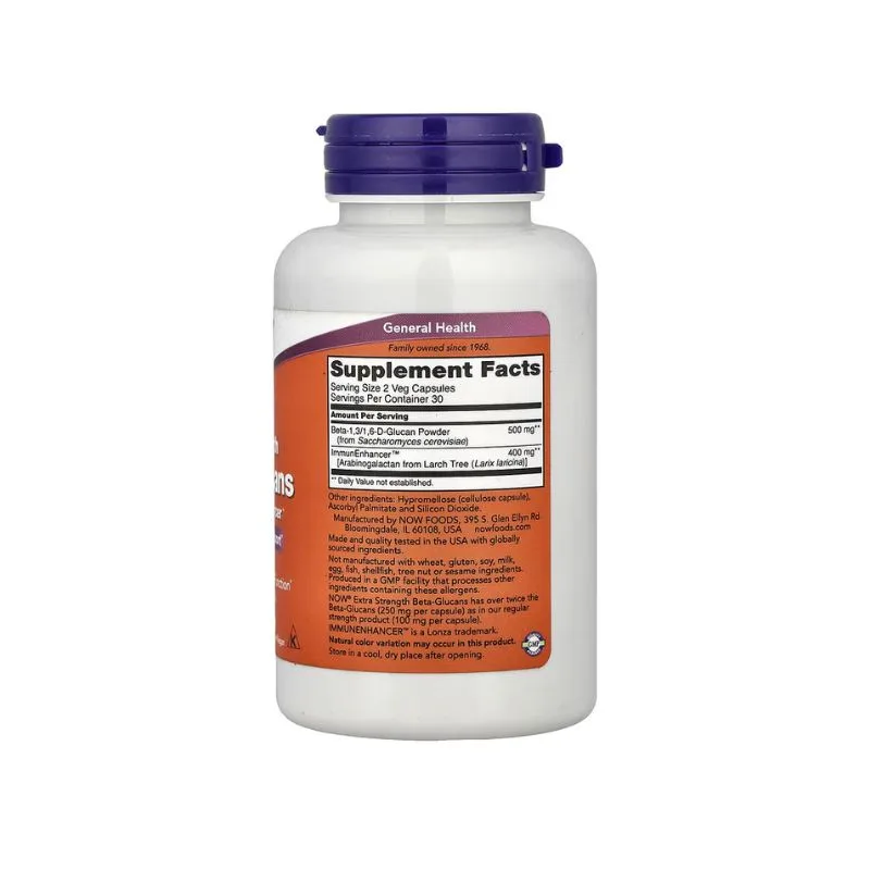 Une bouteille blanche avec un bouchon violet montre l'étiquette de NOW Foods Beta-Glucans with ImmunEnhancer™ Extra Strength, 60 capsules végétales, énumérant les faits et les ingrédients du supplément.