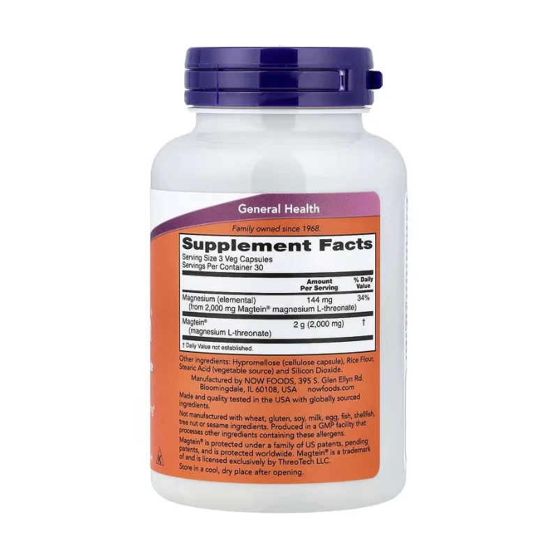 Bouteille blanche de NOW Foods - Magtein® Magnesium L-Threonate (90 gélules végétales) avec un bouchon violet, montrant les informations sur le supplément et les détails des ingrédients sur une étiquette orange et blanche.