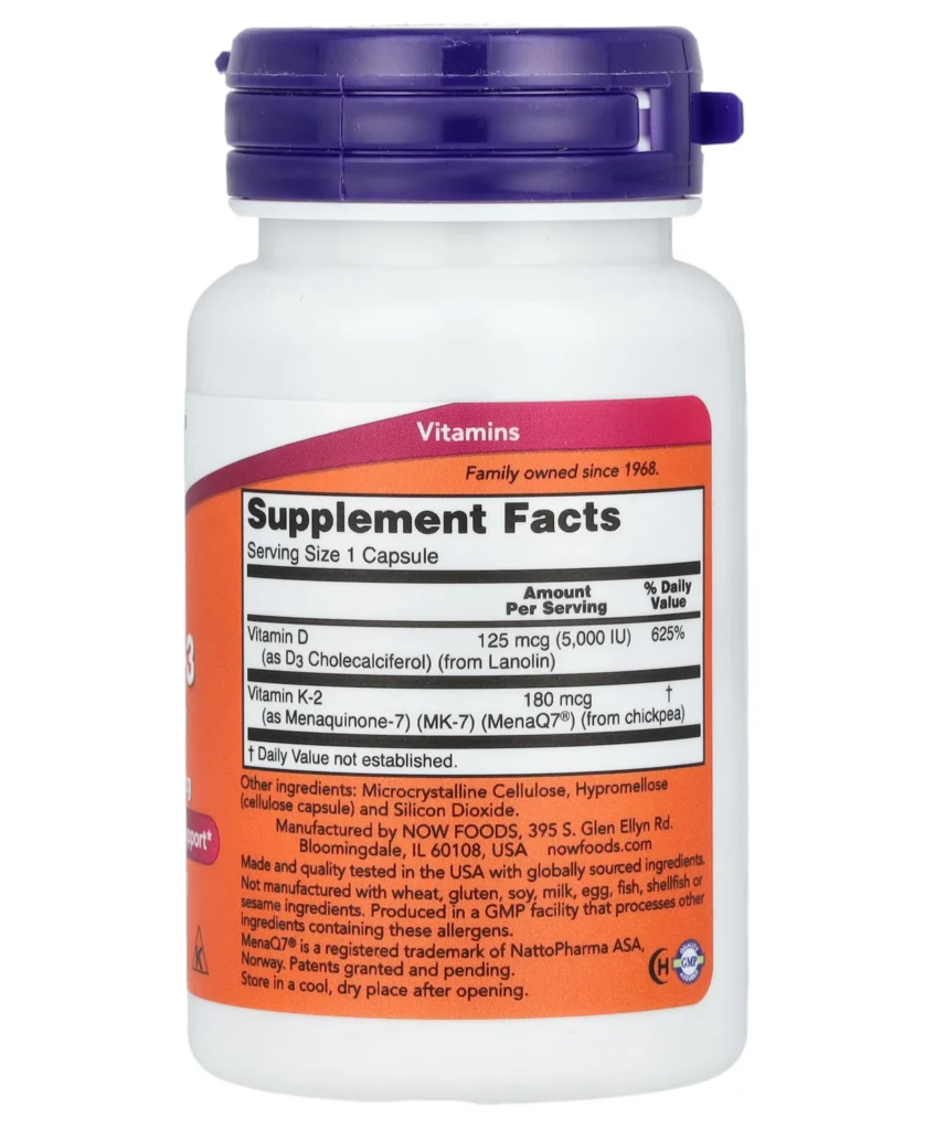 Bouteille blanche avec un bouchon violet comportant une étiquette « Informations complémentaires » répertoriant les vitamines D et K2, ainsi que des informations supplémentaires sur les ingrédients et les valeurs.