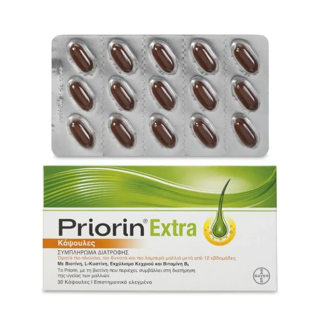 Boîte et blister de Priorin Extra Bayer - Complément Anti-Chute Cheveux Biotine & Millet, un complément alimentaire pour les cheveux contenant 30 gélules avec un emballage vert et jaune avec un texte en grec.
